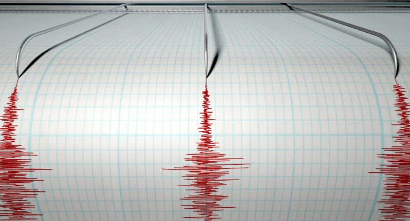 a seismograph measuring the activity of an earthquake