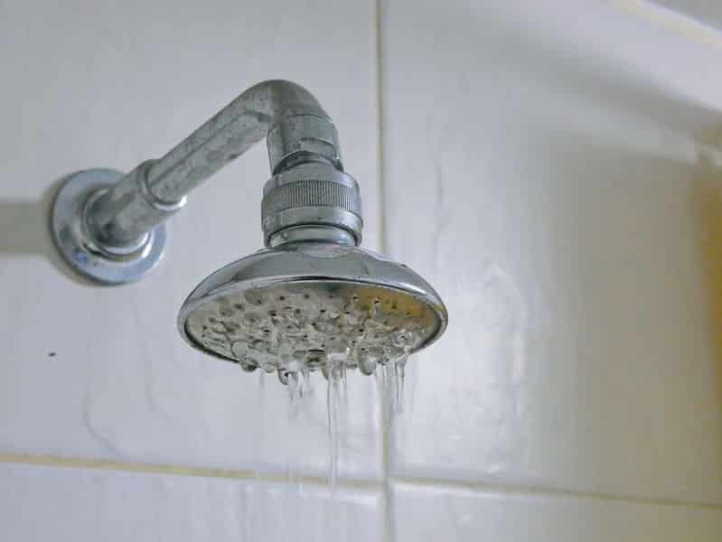 water dripping from a leaky shower head