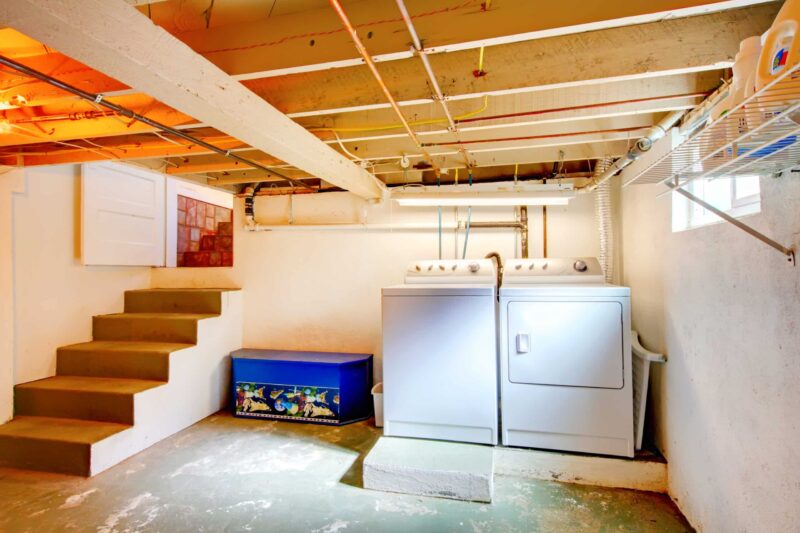a washing machine and dryer unit in the basement of a San Rafael home