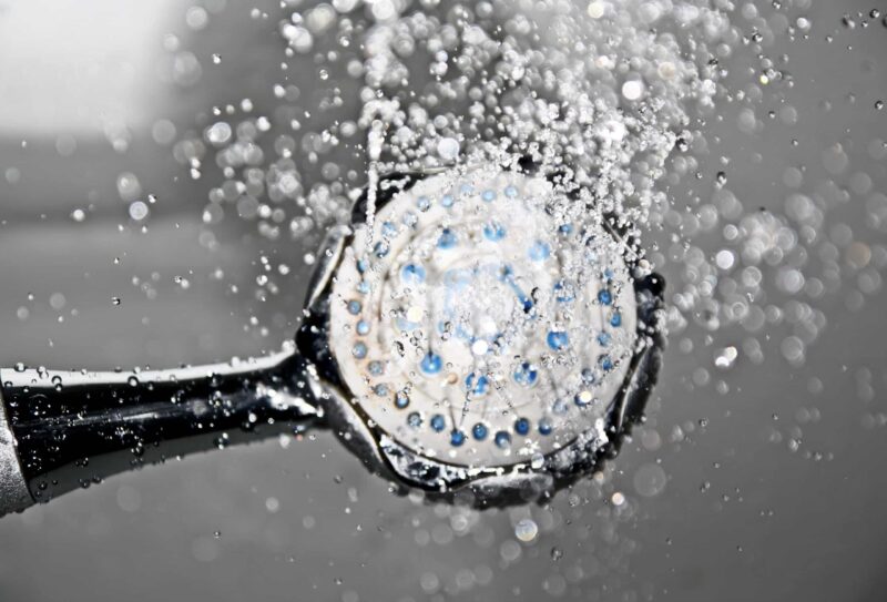 a showerhead spraying water upwards